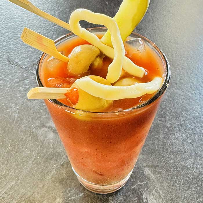 Bloody mary garnished with pickle, sting cheese and olives served at Heritage 71 restaurant and bar in Sherwood, WI
