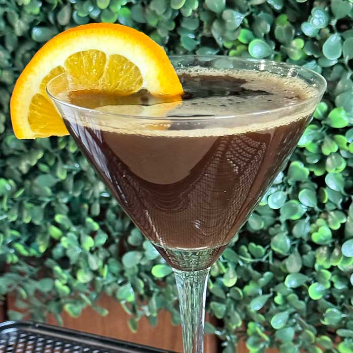 Martini cocktail garnished with lemon wedge served at Heritage 71 restaurant and bar in Sherwood, WI