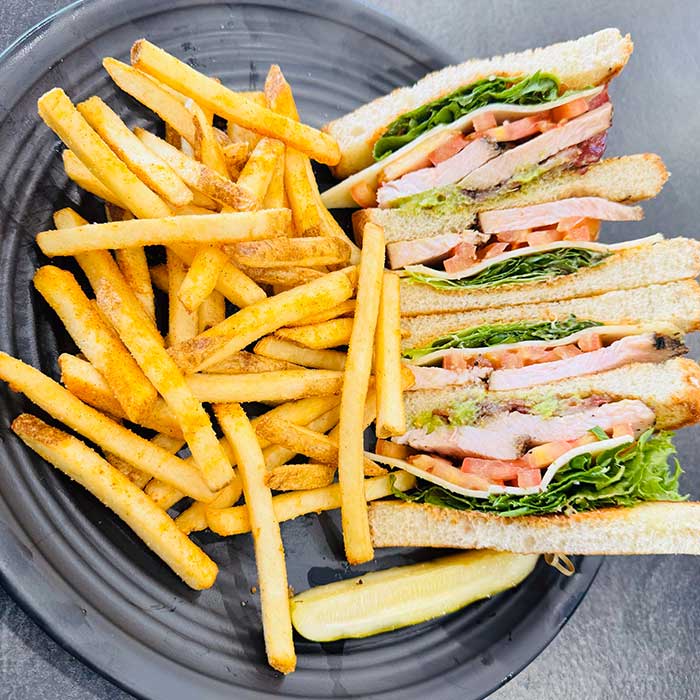 Knife and fork turkey club from sandwich menu served at Heritage 71 restaurant and bar in Sherwood, WI