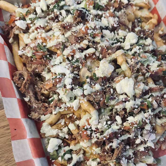 Loaded fries is a great way to start your meal at Heritage 71